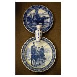 Blue transfer printed pottery charger decorated with a carriage driving scene, another similar