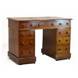 Late 19th Century mahogany twin pedestal writing desk having a skiver inset rectangular top over