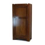20th Century oak hall wardrobe in the Arts & Crafts taste with two panel door enclosing hanging