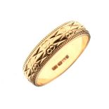 9ct gold wedding band with engraved twin bands of decoration, size N Condition: