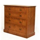 Late Victorian pitch pine chest of two short over three graduated long drawers with brass handles on