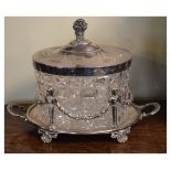 Early 20th Century silver plated and cut glass ice bucket with hinged cover, the oval base fitted