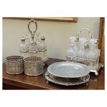 Selection of silver plated items to include: a six bottle cruet of rectangular design on ball