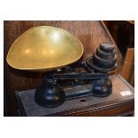 Set of black painted cast iron grocers scales with a brass egg shaped pan Condition: