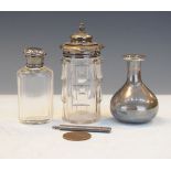 Two silver mounted cut glass bottles, together with a silver pencil holder, metal-wrapped glass