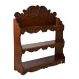 Mahogany three tier hanging shelves having carved scrolling crest and carved apron beneath each