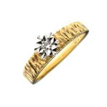 Solitaire diamond ring, the textured shank stamped 18ct, size J½ Condition: