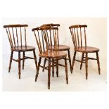 Set of four early 20th Century stained beech stickback kitchen chairs having circular seats and