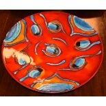 Poole pottery charger having orange, red and blue glaze, 41cm diameter Condition: