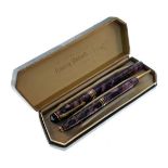 Conway Stuart purple celluloid fountain pen with matching propelling pencil, cased Condition: