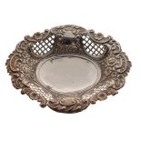 Late Victorian silver bon bon dish of wavy oval design with floral repoussé decoration and pierced