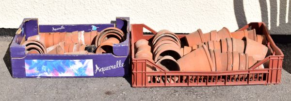 Large collection of approximately 75 terracotta and red stone ware plant pots, ranging from