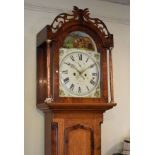 Early 19th Century oak and mahogany crossbanded eight day longcase clock, the painted arched dial