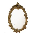 Gilt framed oval wall mirror of foliate scroll design Condition: