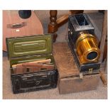 Early 20th Century tin and lacquered brass magic lantern with tin carry box and accessories