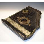 Early 20th Century Columbia guitar zither having ebonised body with applied transfer decoration,