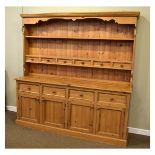 Modern yellow pine high dresser, the upper stage with moulded cornice and shaped valance over