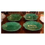 Four majolica leaf design dishes having decoration of strawberries Condition: