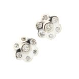 Pair of white metal diamond set daisy cluster earrings Condition: