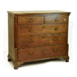 Georgian oak chest of two short over three long drawers flanked by mahogany quarter pilasters with