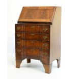 Early 20th Century walnut bureau in the 18th Century taste, the front of inverted breakfront