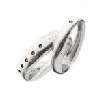 Two silver bands, each set white stones Condition: