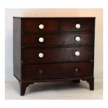 Early 19th Century mahogany chest of drawers, the rectangular top with beaded edge over two short