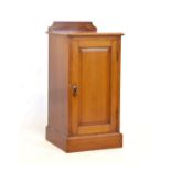 Early 20th Century mahogany bedside cabinet or night cupboard with moulded square top and back