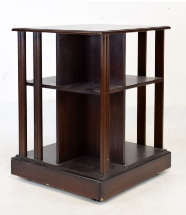 20th Century mahogany revolving bookcase of typical square design with moulded struts and assorted