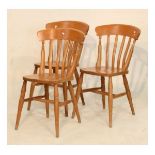 Set of three 20th Century pine kitchen/dining chairs, each with solid 'saddle' seat on turned