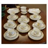 Paragon bone china eight person tea set having gilt decoration of rural buildings in landscapes
