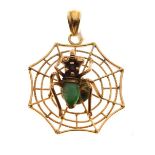 Spiders web design pendant having central spider with a jade body, the reverse stamped 22k