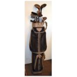 Bag of vintage golf clubs to include: John Letters irons, and four drivers Condition: