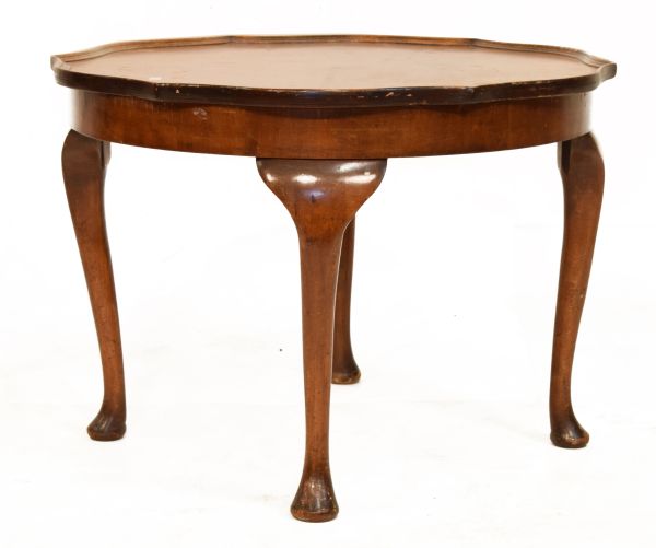 Mid 20th Century walnut occasional table of wavy edged design with quarter top on four cabriole
