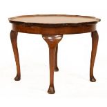 Mid 20th Century walnut occasional table of wavy edged design with quarter top on four cabriole