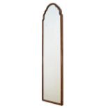 20th Century walnut framed wall mirror of shaped arched design Condition: