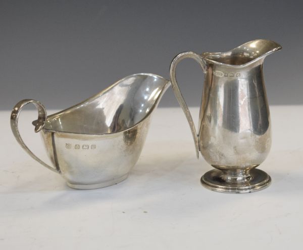 George V silver sauce boat, Birmingham 1930, together with a George VI silver cream jug,