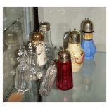 Various ceramic and glass sugar sifters, glass dressing table requisites having silver plated tops