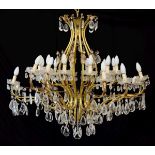 20th Century gilt metal twenty four branch chandelier, the bulbous openwork superstructure with