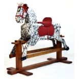 Child's painted wooden rocking horse with dappled decoration on pitch pine and oak sledge base