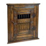 Reproduction carved oak hanging corner cupboard in the early 17th Century taste Condition: