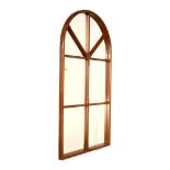 Arched wall mirror of eight panelled design Condition: