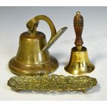 Wall-mounting alloy bell with clapper, a hand bell with turned wooden handle, and a pierced brass