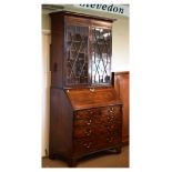 19th Century inlaid mahogany bureau bookcase, the upper section with cavetto-moulded cornice over