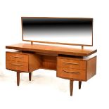 G-Plan twin pedestal dressing table having a rectangular mirror back over kneehole with pull-out