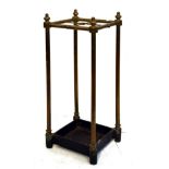 Tubular brass and cast iron four division stick/umbrella stand Condition: