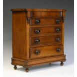 19th Century mahogany 'apprentice piece' chest of drawers, the serpentine fronted top over