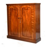 Victorian mahogany two door cupboard or side cabinet, the rectangular top over a pair of panelled