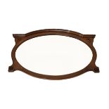 Early 20th Century carved walnut oval wall mirror with bevelled oval plate Condition: