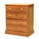 Pine chest of four drawers with wooden knob handles on plinth base Condition: